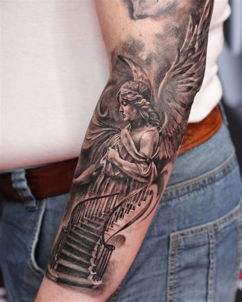 Here is an <b>angel</b> wing design on the forearm sleeve of the guy. . Angel tattoos for men